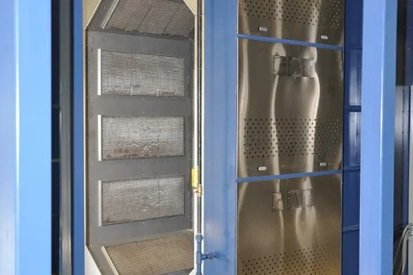 Interior of an infrared oven showing the perforated emitter panels