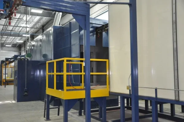 Washer exit leading into the dry-off oven, with a yellow access platform