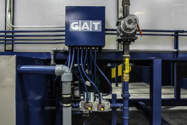 GAT-branded gas train and burner assembly on a washer